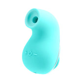 A small, turquoise, bean-shaped electronic device with a power button and plus/minus symbols embossed on its silky-smooth silicone surface. The VeDO Suki - Turquoise Air Suction Clit Stimulator features a nozzle-like opening at one end, indicating it possibly includes vibrating suction modes for personal care or hygiene.